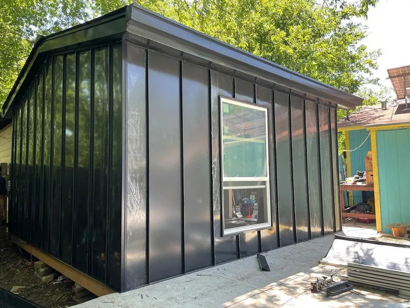 Black standing seam metal wall panels for Roof Inspection in Celebration