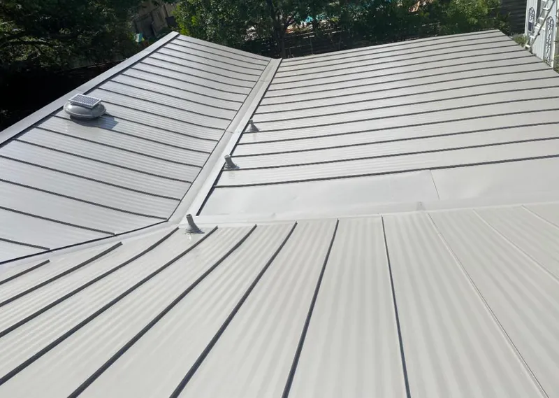 Solar attic fan installed on a metal roof for Roof Ventilation in Celebration
